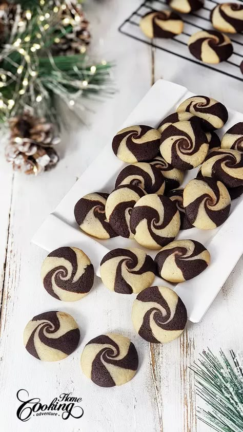 These Christmas Butter Swirl Cookies are a delightful buttery treat perfect for the holiday season. These cookies offer a delicious melt-in-your-mouth experience, combining the creaminess of butter with the richness of chocolate and the classic goodness of vanilla. Christmas Swirl Cookies, Cranberry Gingerbread, Cookie Bars Recipes, Xmas Food Ideas, Christmas Cookie Trays, Christmas Butter, Roulade Recipe, Swirl Cookies, Christmas Cranberry