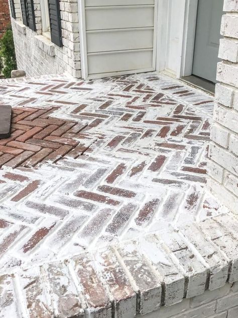 We LOVE our Limewashed Exterior, but our dated red pavers did not match the look we wanted. Here's how to install and mortar wash a herringbone brick patio. Herringbone Brick Patio, Mortar Wash, Herringbone Brick, Brick Porch, Brick Paver Patio, Brick Patio, Brick Walkway, White Wash Brick, Brick Pavers