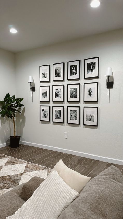 Picture wall, family picture wall, gallery wall, living room decor, neutral home decor, sconces Lounge Room Photo Wall, Small Living Room Picture Wall, Home Picture Wall Ideas, Family Photo Wall With Lights, Family Pictures Frame, Gallery Wall And Sconces, Lounge Photo Wall Ideas, Family Picture Decorating Ideas, Photo Wall Collage With Sconces