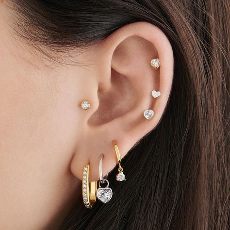 Studs on Instagram: "This Valentine's season, there are no mixed feelings, just mixed metals 🥰 Stack your Earscape® with alternating gold and silver styles for a fun twist ✨" Silver Gold Earring Stack, Mixed Gold And Silver Ear Piercings, Gold And Silver Jewelry Together Ear, Mix Gold And Silver Earrings, Silver And Gold Piercings, Mixed Metal Earscapes, Silver And Gold Earrings Mixing, Gold And Silver Earring Stack, Earring Stacks Mixed Metal