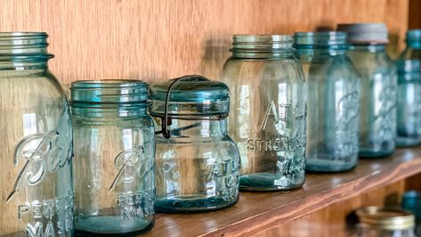 Transform Your Old Mason Jar Into A Sea Glass-Inspired Display Piece - House Digest Mason Jar Storage Ideas, Mason Jar Display, All In One Paint, Jar Image, Sea Glass Decor, Candle Vessels, Paint For Furniture, Jar Display, Square Jars