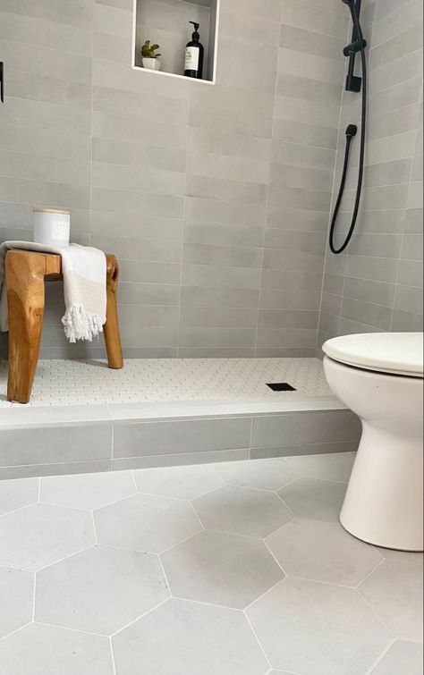 Scandinavian design and soothing colors. White Hex Bathroom Floor, Large Grey Tile Bathroom, Bathroom Floor And Shower Tile Same, Long Tiles Bathroom, Grey Hex Tile Bathroom Floor, Subway Tile Floor Bathroom, Black White Tiles Bathroom, White And Gray Tile Bathroom, Grey And White Floor Tile