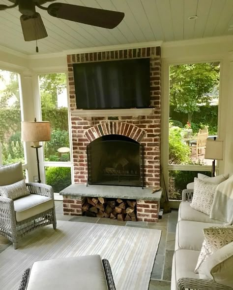 Screened Porch Storage Ideas, Outdoor Fireplace With Log Storage, Outdoor Fireplace With Hearth, Screened In Porch With Brick Fireplace, Fireplace Screened Porch, Porch Fireplace Ideas Farmhouse, Brick Fireplace On Porch, Outdoor Fireplace In Screened In Porch, Wood Storage Under Fireplace Hearth