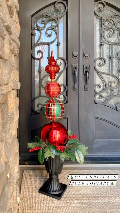 diyfrenchfarmhouse on Instagram: ❤️💚So many things are flying off of the shelves this year...I wanted to share this DIY Christmas Bulb Topiary with you all while the… Ornament Topiary Diy Front Doors, Christmas Ball Topiary Diy, Christmas Ball Topiary Ornament Tree, Christmas Finials Diy, Topiary Christmas Tree, How To Make Christmas Topiary, Christmas Topiary Outdoor Diy, Diy Topiary Ball, Christmas Ornament Topiary Diy