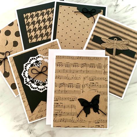 Kraft Greeting Card Set -6 cards and white envelopes -6 different styles/1 of each -Folded Greeting Cards -Blank on the inside -Size A2: 5.5x4.25 inches  DESIGNS:  Cards have white card bases topped with the black and kraft brown designs. All feature attached elements. 1. Dragonfly on stripes 2. Petite polka dots  3. Large polka dots with attached greenery 4. Doily 5. Sheet music with black butterfly 6. Houndstooth USE: Use them for hello notes, miss you, thank you, thinking of you, prayers, birthday cards, and just about anything else! PACKAGING: Cards will be packaged in a clear cellophane sleeve. HANDMADE: All cards are handmade by Dana using only high-quality paper crafting materials and are backstamped with a DandACards logo. SHIPPING: DandACards offers combined shipping.  When you pu Brown Paper Greeting Cards, Cards Made With Kraft Cardstock, Thinking Of You Stampin Up Cards, Unique Cards Handmade, Music Birthday Card, Masculine Cards Handmade, Butterfly Cards Handmade, Black And White Cards, Note Cards Handmade