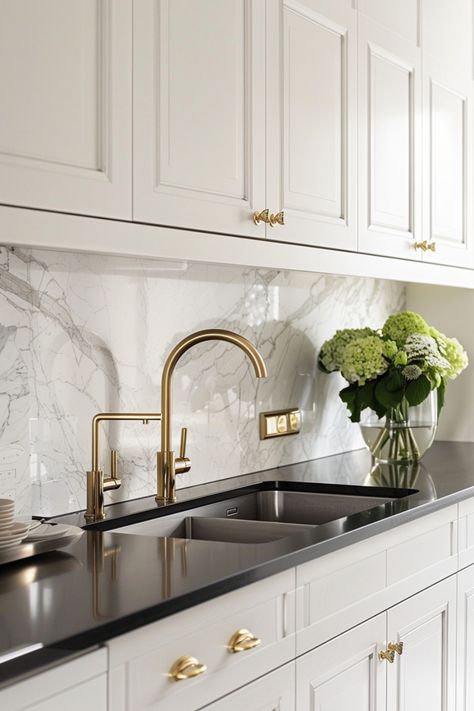 Use these tips to make your kitchen look extra-chic with white kitchen cabinets and black countertops. White Black Gold Kitchen, White Cabinet Black Countertop, Black Counter Kitchen, White Cabinets Black Countertops, Black Kitchen Countertops, White Cupboards, Kitchen Cabinet Inspiration, Marble Countertops Kitchen, Kitchen Improvements