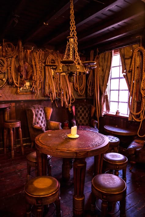 Pirates Restaurant Interior Design, Pirate Dining Room, Pirate Themed Restaurant, Modern Western Bar Design, Western Restaurant Interior, Pirate Aesthetic Room Decor, Tavern Astethic, Pirate Tavern Aesthetic, Pirate Ship Interior