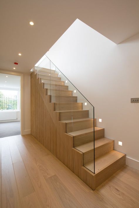 Oak staircase with frameless glass balustrade from hallway to upper level open plan living space. Penthouse apartment in Kensington. DDWH Architects Diy Stair Railing, تحت الدر�ج, Frameless Glass Balustrade, Wooden Staircase, Stairway Lighting, Interior Staircase, Glass Stairs, Staircase Remodel, Wood Staircase