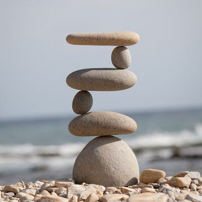 Rosecliff Heights Representing safety, hope, and friendship, cairn stones have been used by cultures around the globe for centuries. Made of real stones and a steel rod, each cairn garden stone used is selected for its unique and appealing aesthetic. Whether serving as a memorial stone or a directional marker, cairn stones add a sense of balance and calm to the hectic pace of daily life. These stones are stacked up high with natural beach pebbles and river rocks. Every single piece is hand-selec Ideas Para Decorar Jardines, Rock Cairn, Pagoda Garden, Garden Rock Art, Rock Sculpture, Art Pierre, Pebble Stone, River Stones, Memorial Stones