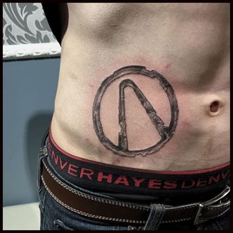 Weathered Style Design of Vault Symbol from Borderlands video game series Borderlands Tattoo, Game Tattoo, Simple Tats, Wolf Tattoo Sleeve, Video Game Tattoo, Loading Screen, Trending Tattoo, Symbol Tattoo, Tattoo Symbols