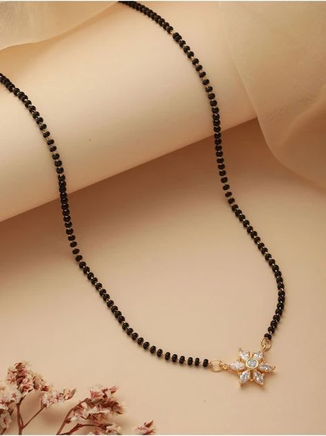 Buy beautiful and charming mangalsutra chains from our gold and diamond collection. Traditional Mangalsutra Designs Gold, Karimani Mangalsutra, Black Beads Mangalsutra Design Simple, Karimani Chain Designs, Small Mangalsutra Designs Gold, Small Mangalsutra, Gold Jewelry Prom, Blue Blouse Designs, Emerald Stone Rings