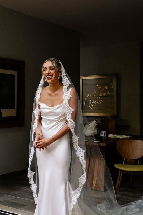 This lace edged cathedral length mantilla bridal veil was designed for modern romantics seeking a wedding veil that will compliment their timeless and elegant style. Characterized by its soft drape and bold scalloped lace, this long veil takes decadence to a whole new level. A timeless accessory. Request FREE samples! Veil Top Of Head, Scallop Veil, Veils Vintage, Spanish Veil The Wedding Veil Shop, Cathedral Veil With Lace, Lace Trim Wedding Veil, Wedding Dresses With Veil Over Face, Satin Wedding Dress Lace Veil, Veil With Lace Trim