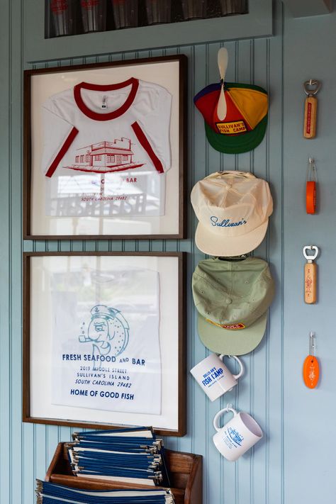 Sullivan’s Fish Camp Now Open on Sullivan’s Island - Eater Carolinas Clothing Display For Small Space, Nautical Interior Design Bedroom, Nautical Hotel Room, Old Florida Fish Camp Decor, Camp Office Ideas, Eclectic Surf Shack, Sullivans Fish Camp, Eclectic Lake House, Vintage Lakehouse Decor