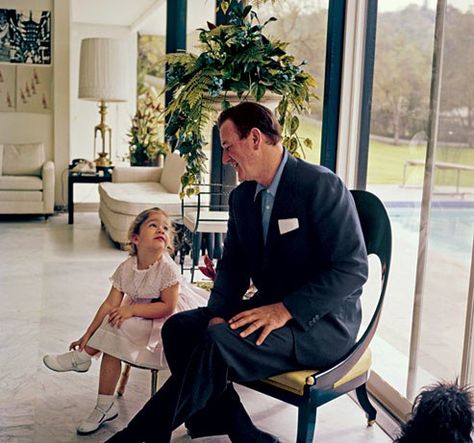 Aissa and her famous dad in the sleekly modern poolhouse. "My mom always told me to cross my legs for pictures. I can tell that my right hand is helping the leg stay." Duke Wayne, Ben Johnson, Wayne Family, Tv Icon, Actor John, San Fernando Valley, I John, John Wayne, Classic Hollywood