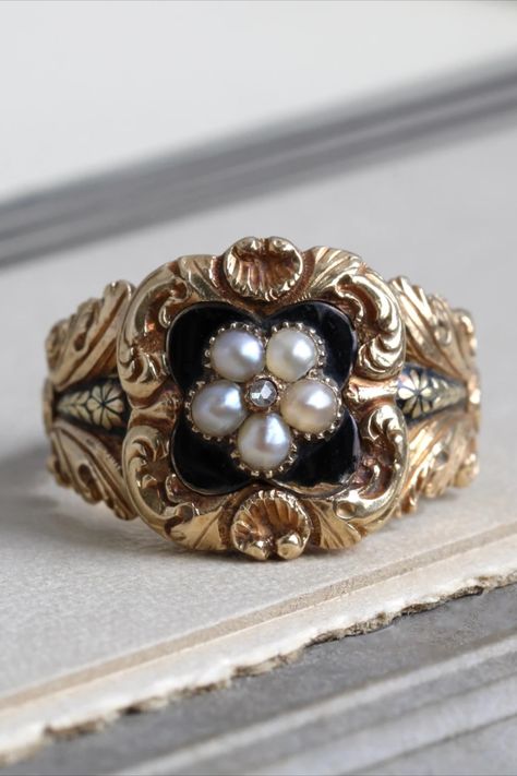 Antique yellow gold ring with black enamel and a pearl flower in the center, surrounded by a floral scroll pattern. Georgian Rings Antique, Black And Gold Engagement Ring, Georgian Engagement Ring, Pirate Wedding, Victorian Style Rings, Sunburst Ring, Georgian Ring, Antique Gold Rings, Georgian Jewelry