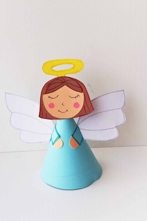 One of my favorite Christmas paper crafts for preschool is this cute angel craft!! Make your very own Christmas angel using my free printable template and instructions! One of the very easy Christmas crafts! Angel Projects For Kids, Toilet Paper Angel Craft, Angel Making Crafts, Angel Tree Topper Diy Kids, Angel Toddler Craft, Mary And Angel Gabriel Craft, Shepherds And Angels Craft, Guardian Angel Craft, Paper Angel Craft