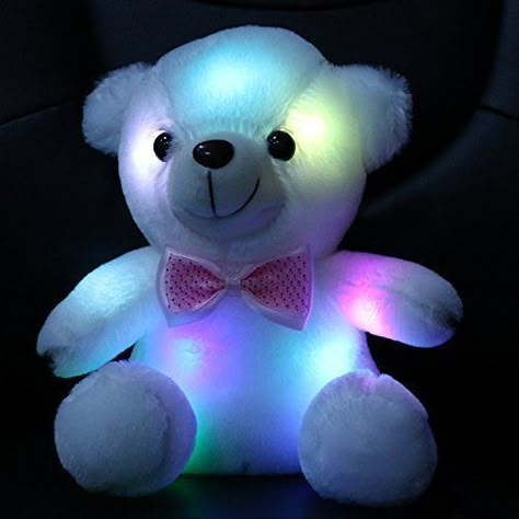 Isn’t this stuffed teddy bear just adorable? It’s white, made of cotton, eight inches tall, and super soft. When you press the “On” button, the LED lights inside glow and change colors.      It works wonderfully as a nightlight and can be very soothing to toddlers at bedtime. Teddy Bear Pics, Cute Teddy Bear Pics, Purple Teddy Bear, Bear Pics, Best Toys For Kids, Best Gifts For Kids, Teddy Bear Images, Bear Images, Teddy Bear Pictures