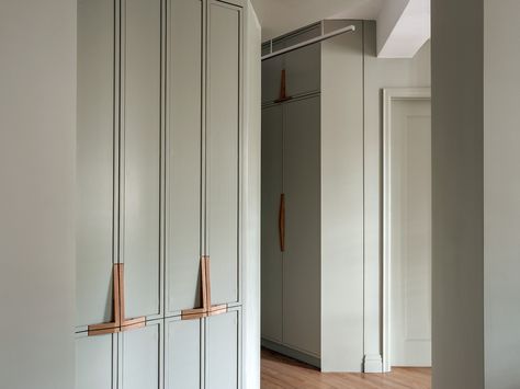 This project involved a complete reorganization of spaces, with highly tailored mill work creatively positioned throughout. The cabinets define the programmatic elements of the home. Modern in form, simple in material, but complex in texture, hand painted elements conceal a warm walnut beyond. Rich wood and colorful brass create a sense of grace and punctuate a backdrop to the bustle of everyday life.  3d pulls color change Joinery Details, Wardrobe Designs, Architecture Landmark, Entry Hall, Furniture Details, Wardrobe Design, Custom Cabinets, Built Ins, Interior Details