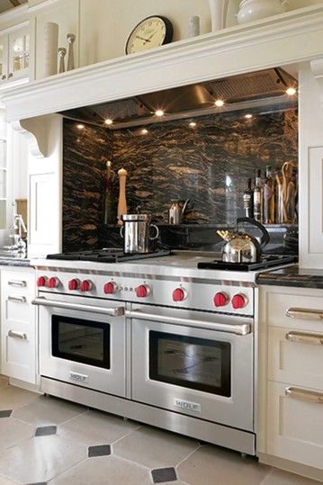 The Wolf range is recognizable for its signature red knobs, which also come in stainless... Double Oven Island, Double Oven Kitchen Layout, Wolf Kitchen, Kabinet Dapur, Kitchen Stove, Double Oven, Luxury Kitchens, Kitchen Inspo, Counter Tops