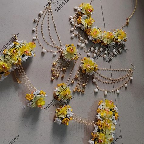 Blend of tradition and style is this set  Beautiful yellow white flowers with Jasmin bud touch in earrings and necklace  www.sunehrijewellery.com For order or enquiry Whatsapp us 9205912715 link in bio Or order from our website  . . . . . . ...  . . .   .  .  . . . . . #shelljewellery #floraljewellery #flowerjewellery #floraljewelry #indianwedding #haldijewellery #floraljewelleryformehendi #floraljewelleryforhaldi #bridalfloraljewellery #bridaljewellery #gotajewellery #wedmegood #wedding #f... Artificial Flower Jewellery, Yellow White Flowers, Haldi Jewellery, Haldi Outfit, Fancy Jewellery Designs, Indian Bridal Dress, Quotes For Friends, Earrings And Necklace, Fancy Jewellery