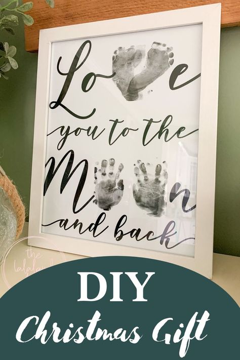 Use your baby's feet and hands to make this adorable love you to the moon and back keepsake. Makes the perfect homemade Christmas present for grandparents, aunts, uncles or just to hang on your wall! Check out my blog post to see how I did this with mess free ink pads and my 10 month old daughter. I have some good tips to help you make this fun and beautiful! Valentines Gift From Baby To Daddy, Baby Hand Print Art, Hand Print Canvas Ideas, Baby Hand And Foot Prints Crafts, Hand And Footprint Art, Baby Hand And Foot Prints, Baby Christmas Crafts, Baby Art Crafts, Grandparents Christmas