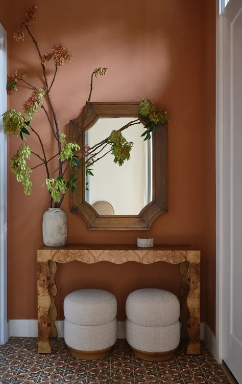 As we head into fall, opting for earthy tones are going to ensure your small entryway feels cozy and never poky. The warm terracotta shade is not only a warm and inviting color but since it feels like a neutral, can be accessorized throughout the year at minimal extra cost. (Image credit: Michael Clifford, design by Moksa Studio.) Small Entry Paint Colors, Entry Wall Painting Ideas, Small Home Wall Colors, Entry Paint Colors Entryway, Corridor Color Walls, Pink Foyer Entryway, Tiny Entry Way Ideas, Entryway Wall Painting Ideas, Small Entryway Inspiration