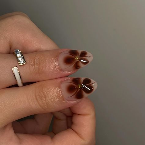 fall set🦦 @roubie_s • • using @apresnailofficial médium sculpted almond • • • • #nailsbyrosane #nails #nailsmtl #nailtech #nailtechmtl #ongles #gelxnails #apresgelx #mtl #ignails #simplenails #frenchtipnails #nailart #nailinspiration #prettynailssalon #evileye #man #manicure #natural #haileybieber #chrome #fallnails #brown #brownnails #fallset #falldesign Brown Flower French Tip Nails, Brown And White Flower Nails, Brown Flowers Nails, Brown 3d Flower Nails, Brown Airbrush Nails, Brown Blooming Gel Nails, Brown Flower Nails, Brown Nails With Chrome, Man Manicure