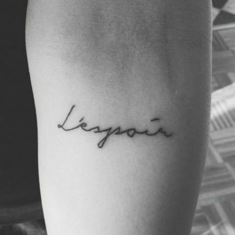 20 One-Word Tattoo Ideas For The Minimalistic Woman Tattoo Ideas In French, L'espoir Tattoo, Espoir Tattoo, One Word Tattoo Ideas, French Word Tattoos, French Tattoo Quotes, Latin Tattoo, One Word Tattoo, Word Tattoo Ideas