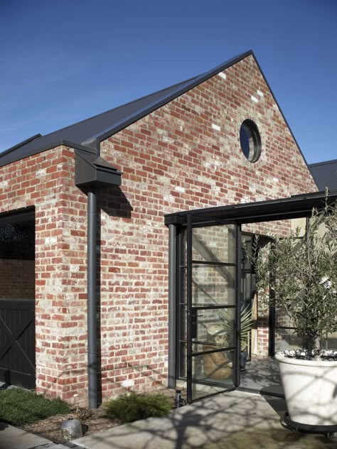 A Black Kitchen Is A Bold Design Choice For This Home Recycled Brick House, Brick Exterior Ideas, Connected Buildings, Italian Rivera, Wattle Tree, Timber Trusses, Red Brick Exteriors, Tree Road, Brick Accent Wall