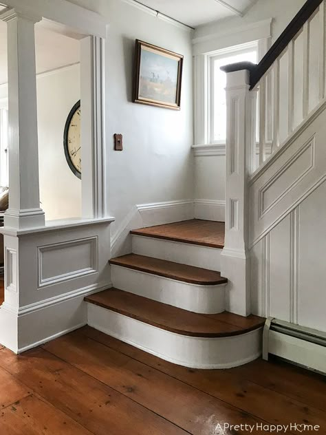 Fancy trim makes all the difference on a Colonial Farmhouse Staircase. Dark Trim Staircase, White Craftsman Staircase, European Farmhouse Staircase, English Staircase, Colonial Stairs, Craftmans House, Colonial Staircase, Vintage Staircase, Cottage Staircase