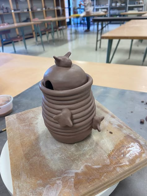 #ceramics #coil #pinchpot #honey Beehive Coil Pot, Clay Coils Ideas, Heart Coil Pot, Coil Pottery Ideas Mugs, Coil Ceramics Ideas Design, Cute Coil Pot Ideas, Coiled Clay Projects, Animal Coil Pots, Decorative Coil Pots