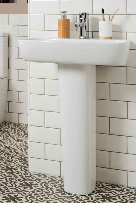 Get inspiration for adding practical storage to your pedestal sink while infusing your bathroom with function and style. #bathroomstorageideas #declutter #declutterideas #homeorganization #howtoclean #organizationtips #thespruce Shelf For Pedestal Sink, Small Bathrooms With Pedestal Sinks, Half Bathroom Ideas With Pedestal Sink, Half Bath With Pedestal Sink, Pedastool Sink, Under Pedestal Sink Storage, Pedestal Sink Storage Ideas, Pedastal Sink, Bathroom With Pedestal Sink