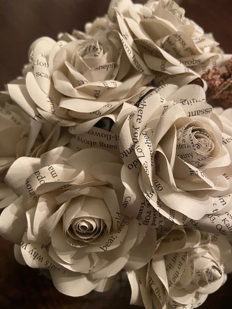 This flower is made from pages of a random book and makes the perfect gift alternative to fresh flowers (no water required). Each rose is made from an up-cycled book. This makes a great 1st Anniversary gift!  If you would like to request a specific book we are happy to custom make it as long as we are able to source the book paper. Please note this may incur an additional charge. Sizes are approximate *  The rose head is approximately is 3 to 4 inches in diameter and the stem is approximately 10 inches long.  Local pick-up is available. Please contact me before purchasing.  ABOUT OUR FLOWERS: I hand-cut each petal from a pattern specifically created for the style of the flower we use in each piece. Each flower will be styled and curled petal by petal to create a beautiful handmade paper ro Anniversary Crafts, Easy Paper Flowers, Upcycle Books, Floral Tape, Flower Ideas, Paper Book, Paper Roses, Flower Crafts, Book Crafts