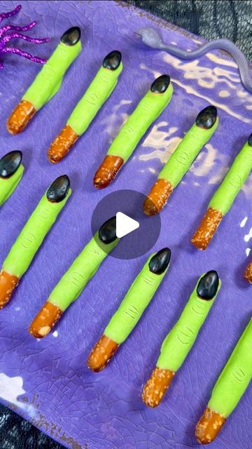 Genevieve LaMonaca on Instagram: "Witch Fingers🧙 Follow @chefgenevieve for 50 halloween recipes #halloweenfood #halloweeninspo #witchfingers #halloweenfoodideas

Ingredients:

10 pretzel rods
20 whole almonds (*see tip below)
10oz white melting wafers
1 tsp green gel food coloring
2 Tbsp powder sugar
1 tsp water 1 drop black food coloring

Directions:
Cut pretzel rods in half. Melt chocolate according to package directions (Melt for 45 seconds in the microwave then stir, then return to the microwave in 15 second increments stirring in between until fully melted. Do not overcook or the chocolate will clump)

Dip pretzel rods cut side down into chocolate. While still wet add an almond as the nail.

For the Black icing polish, mix powder sugar with water and black food coloring. Use a small Halloween Wafer Cookies, Pretzel Witch Fingers, Witches Fingers Pretzels, Witch Finger Pretzel Rods, Halloween Sides For Party, Witch Finger Pretzels, Halloween Dipped Pretzel Rods, Chocolate Dipped Pretzel Rods Halloween, Pretzel Rods Halloween