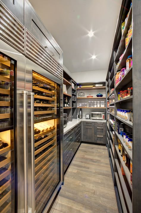 This state of the art walk in pantry includes ample storage, dual wine refrigerators, a Caesarstone  countertop for extra work space, and plenty of open shelving for dry foods storage. Luxury Pantry, Walk In Pantry Ideas, Pantry Layout, Dream Pantry, Desain Pantry, Pantry Room, Kitchen Organization Pantry, Kitchen Pantry Design, Butlers Pantry