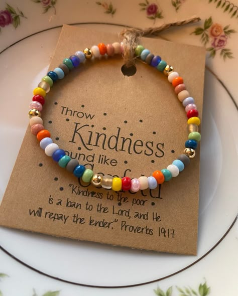 "The KINDNESS bracelet - THROW KINDNESS AROUND LIKE CONFETTI! A colorful reminder to BE KIND, Always! These are made with 4mm seed beads beads accented with 4mm gold filled beads. Each bracelet comes with the \"Kindness Card\" with scripture * Each bracelet color patterns will vary Listing includes ONE Mini Kindness bracelet ONLY - the larger Kindness Bracelet is available in another listing." Bracelet Tags Ideas, Diy Bead Bracelet Ideas, Kindness Bracelets, Easy Beaded Bracelets, Diy Friendship Bracelets, Selling Bracelets, Kindness Gifts, Blessing Bracelet, Faith Bracelet