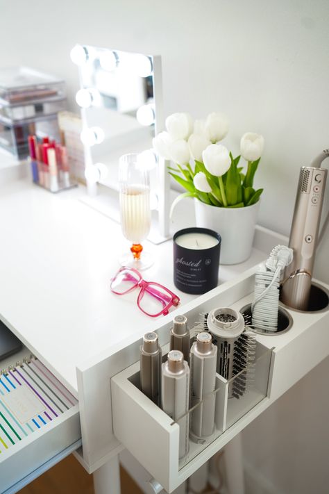 Add a hair tools organizer to the side of your desk to create an area that doubles as a work and GRWM station. Vanity Ideas Organization Hair Tools, Small Get Ready Station, Hair Station Ideas Bedroom, Under Desk Makeup Storage, Makeup Vanity With Hair Tool Storage, Makeup Station Bathroom, Small Makeup Area Ideas, Home Hair Station, Hair Station Decor