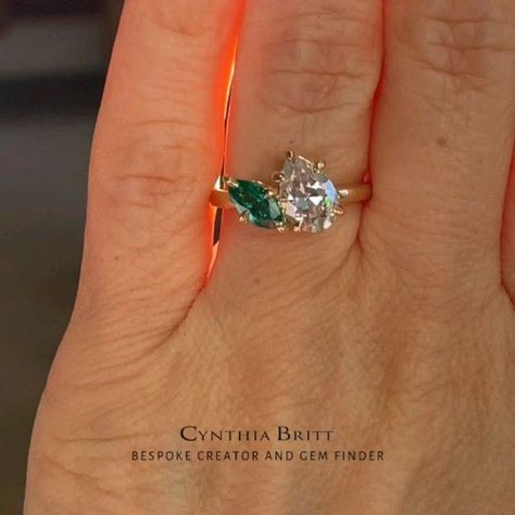 Cynthia Britt Custom Jewelry on Instagram: "A Two Stone engagement ring for lovely Michelle!  🌟Story: Julian came in for a surprise engagement ring for Michelle. He knew Michelle wanted a two stone engagement ring with one diamond and one emerald. Julian and Michelle are both professional dancers. He showed me their pictures while performing. Looking at pictures of Michelle's hand, I suggested different shapes and different angles for the positioning of the two stones. Julian decided to have a larger pear diamond and a smaller marquise shaped green emerald.   For a second meeting, I first brought in the pear shaped diamond for him to choose from. After he picked his favorite pear, then I sourced out a few marquise shaped emerald stones that would compliment the pear. We both picked the mo Two Stone Engagement Ring, Surprise Engagement, Professional Dancers, Romantic Getaway, Stone Engagement Ring, Stone Engagement Rings, Different Angles, Emerald Stone, Pear Shaped Diamond