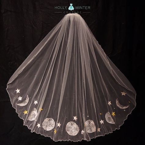 An ivory fingertip veil embroidered with phases of the moon and stars by Holly Winter Couture Moon And Stars Wedding Veil, Moon Phase Veil, Starry Wedding Veil, Moon Wedding Veil, Galaxy Wedding Veil, Celestial Wedding Veil, Sun And Moon Wedding Theme, Starry Veil, Starry Wedding Dress