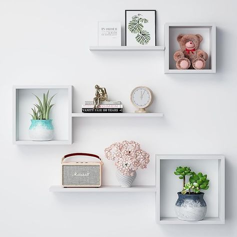 About this item 【Multifunctional Floating Cube Shelves】A set of 6 different sized shelves, including 3 square storage shelves and 3 wall mounted floating shelves, can help you create your own storage combinations for different display needs. Reduce clutter and highlight your stylish decor while keeping everything organized. You can hang them together in a collage style or use individually. 【Modern & Rustic Design】The wall box shelf features a unique cube solid structure with floating shelves to provide more storage space. The driftwood finish creates a beautiful and natural look that will add a modern ambiance to your living space. You can create an exquisite design collage wall with your favorite photos, plants, collectibles, etc. 【Perfect for Display】Let your creative side rub off with d Floating Square Shelves, Square Shelves On Wall, Square Shelves Decor Cubes, Square Shelf Decor, Floating Box Shelves, Wood Honeycomb, Floating Cube Shelves, Square Shelves, Square Floating Shelves