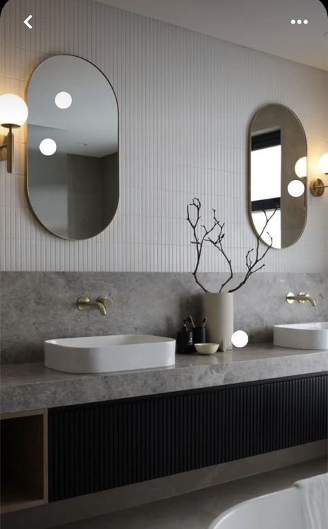 Hotel Lobby Bathroom, Dezeen Bathroom, Modern Luxe Interior Design, Contrast Bathroom, Reeded Door, Oval Mirrors, Bathroom 2023, Stone Vanity, Restroom Design