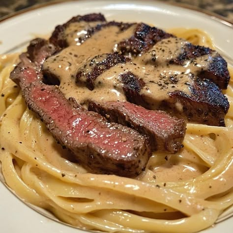 🔥🧄 Creamy Cajun Steak Alfredo 🥩🍝 Ingredients 1 lb steak 🥩 (ribeye, sirloin, or your choice) 8 oz fettuccine or linguine pasta 🍝 1 tbsp Cajun seasoning 🌶️ 1 tbsp olive oil 🫒 2 tbsp butter 🧈 3 cloves garlic, minced 🧄 1 cup heavy cream 🥛 1 cup Parmesan cheese, grated 🧀 Salt & pepper to taste 🧂 Fresh parsley, chopped 🌿 (for garnish) Instructions Cook the Pasta: Bring a large pot of salted water to a boil. Cook the fettuccine or linguine according to package directions until al dente. Drain and s... Steak Pasta Recipes, Mince Meals, Steak And Pasta, Cajun Steak, Steak Alfredo, Boil Cook, Steak Ribeye, Carribean Food, Leftover Steak