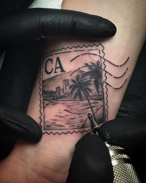 High Voltage Tattoo on Instagram: “The perfect way to remember your stay in LA! Sick stamp tattoo done today  by @saigonkicker #california #palmtree #losangeles…” Cali Inspired Tattoos, San Diego California Tattoo Ideas, California Sleeve Tattoo Ideas, California Stamp Tattoo, California Tattoo For Women, Hotel California Tattoo, Socal Tattoo, Cali Tattoo Ideas, California Inspired Tattoo