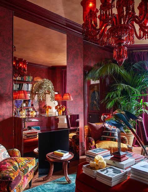 A damask wallpaper by Adelphi Paper Hangings wraps the library walls. French 1930s lamps and c. 1925 Indonesian... 1960s Chairs, Balloon Shades, Iznik Tile, Ikea Table, Maximalist Interior, Library Wall, All Things Red, Custom Mirrors, Chiavari Chairs