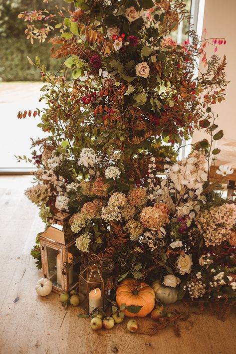 A romantic Autumnal Wedding Ceremony at Surrey countryside Wedding Barn Venue, Millbridge Court | The most gorgeous asymetric floral installment with an abundance of autumnal bracken, foliage, seasonal squashes and hints of blush pink | Floral arrangements by Meadow Folk | Captured by The Springles Floral Hedge Wedding, Emma And Tom, Pink Floral Arrangements, Millbridge Court, Winter Ceremony, Floral Portfolio, Alt Wedding, Pumpkin Wedding, Autumnal Wedding