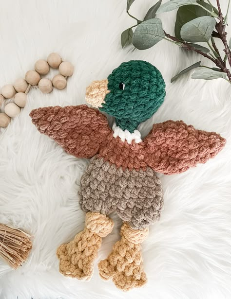 The most adorable new friend for your little! Ready to cuddle with a flat body, stuffed head and tail. Perfect for your little one to hug, carry and snuggle.  Moving, new sibling being born, time to give up the pacifier? Mallard duck lovey is great for bringing comfort too! Sure to be a perfect gift for any child.  Great for duck or hunting themed nursery decor too!  Measures 14" long from beak to feet and is  made of soft blanket yarn. Comes with embroidery eyes which are suitable for all ages! Bass Pro Nursery, Marsh Themed Nursery, Ducks Nursery Theme, Hunter Nursery, Baby Boy Nursery Duck Hunting, Mallard Duck Decor, Nursery Ideas Outdoor Theme, Waterfowl Nursery, Duck Theme Nursery