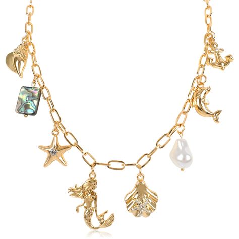 PRICES MAY VARY. 🧜‍♀️CUTE CHARM NECKLACE🧜‍♀️The summer, let your style embrace the ocean, weaving through golden waves. Our ocean-themed golden pendant necklace, with its dazzling gold and exquisite design, brings you on a shimmering journey through the sea. Its unique paperclip chain adorned with multiple adorable pendants, including the mermaid, starfish, seashell, conch, pearl, dolphin, and anchor, each one captivating, as if taking you on a dreamy stroll along the beach. 🐚GOLD PENDANT NEC Ocean Weaving, Indie Bracelets, Dreamy Jewelry, Chunky Gold Jewelry, Dream Items, Golden Pendant, Conch Pearl, Summer Beach Jewelry, Ship Anchor