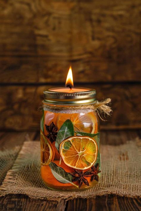 How To Make Your Own Summer Scented Mason Jar Candle! - Mental Scoop Diy Mason Jar Oil Candles, Oil Mason Jar Candles, Oil Candles In Mason Jars, Mason Jar Tea Light Candles, Dried Flowers For Candles, Diy Oil Candles Mason Jars, Candle Jar Crafts Diy, Cool Homemade Candles, Diy Oil Candles