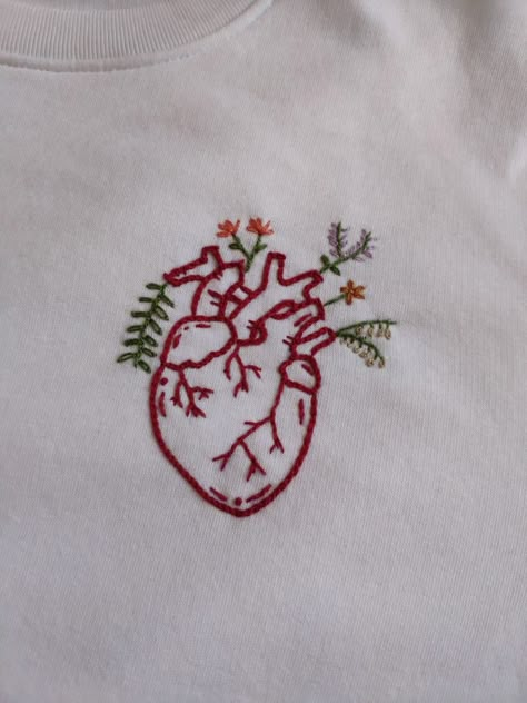 Follow me on my personal page @hilotendido on Instagram for more ✨ Red And White Embroidery Ideas, Embroidered Shirt For Boyfriend, Red Shirt Embroidery, Embroidered Anatomical Heart, Embroidery For Him, Embroidery Designs For Boyfriend, Tshirt Embroidery Diy, Embroidery For Boyfriend, Embroidered Hoodie Diy