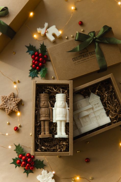 Gift box with 2 Nutcrackers of your choice Variation: 2 Nutcracker ivory color 1 ivory, 1 caramel color 2 caramel color ----------------------------  Gift Box is the perfect gift for yourself, friends or family.  Dimensions: ---------------- H: 5,31 inch  W: 2 inch Dimensions of Box 8 inch x 4,1 inch x 2,3 inch Boxes come wrapped in olive-green satin ribbon Shipping:  ------------- Every candle carefully wrapped and secure placed into shipping box surrounded additional protection layer. Candles are made to order so please allow up to 3-5 business days for dispatch (excluding shipping times).                   About candle: ------------------- Our candles are made with all-natural premium-quality Soy Wax and cotton wicks. They are non-toxic and eco-friendly alternatives to Paraffin wax. Can Christmas Gift Box Decoration, Christmas Candle Gift Box, Christmas Candle Gift Ideas, Christmas Candle Gift Set, Christmas Candles Ideas, Candle Gift Box Ideas, Christmas Candles Decorations, Christmas Candle Ideas, Nutcracker Candle